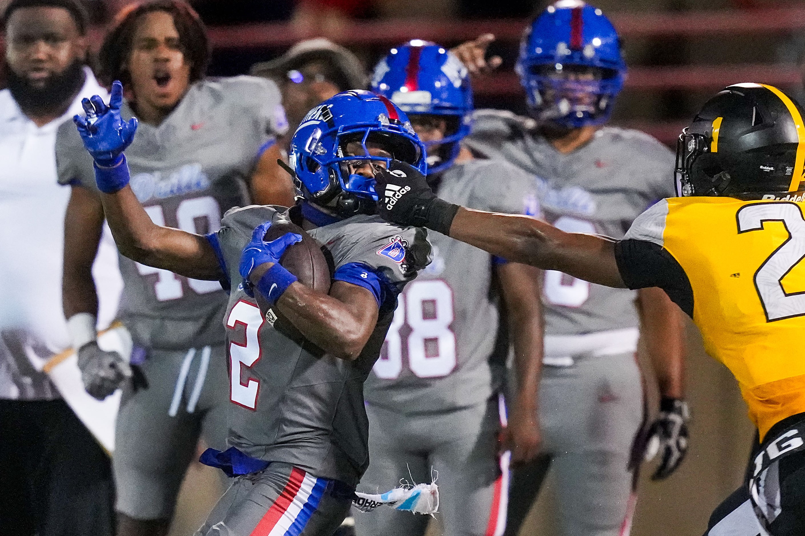 Duncanville wide receiver Ayson Theus is pulled down by his facemask by St. Frances Academy...