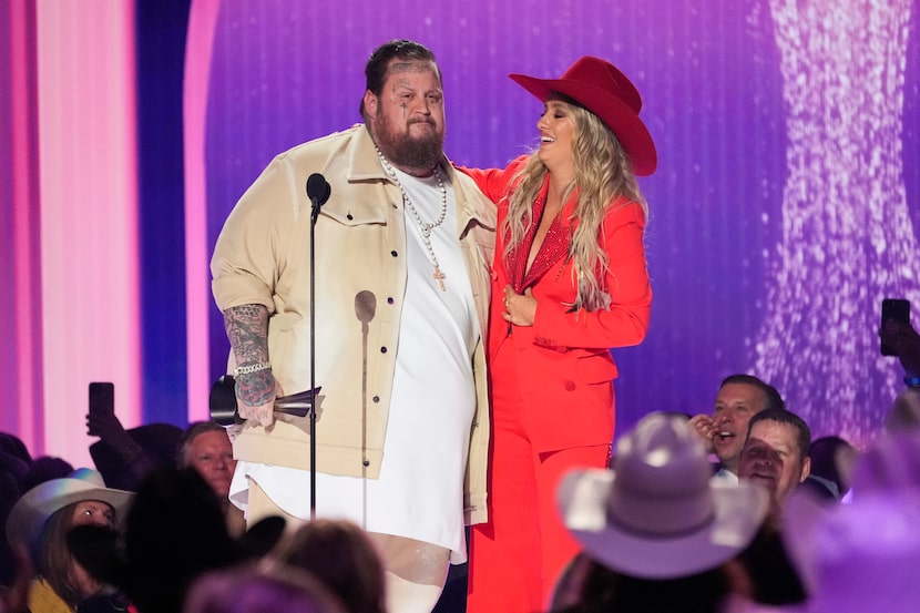 Jelly Roll, left, and Lainey Wilson accept the award for music event of the year for "Save...