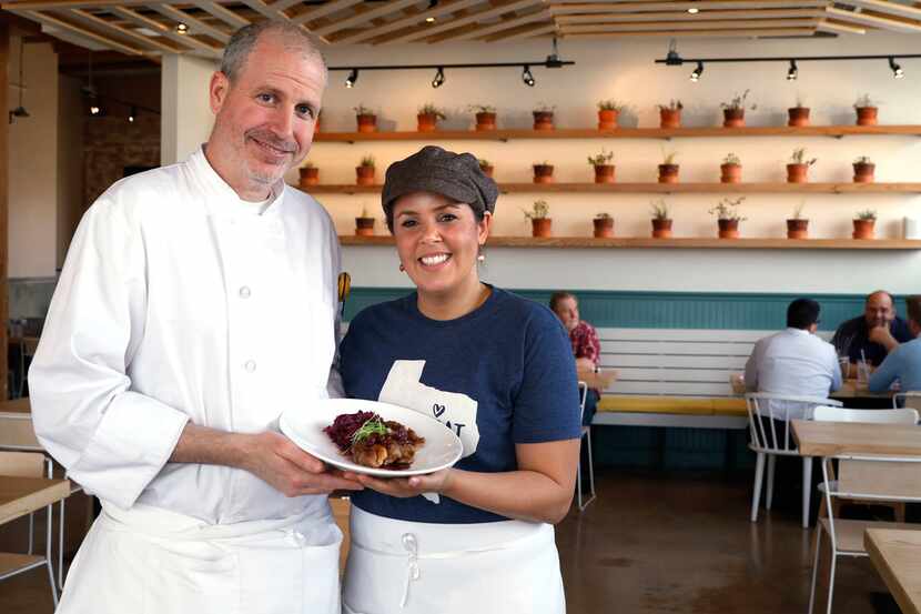 Jeff and Julie Williams hold a plate of duck scaloppini with red cabbage and cherry wine...