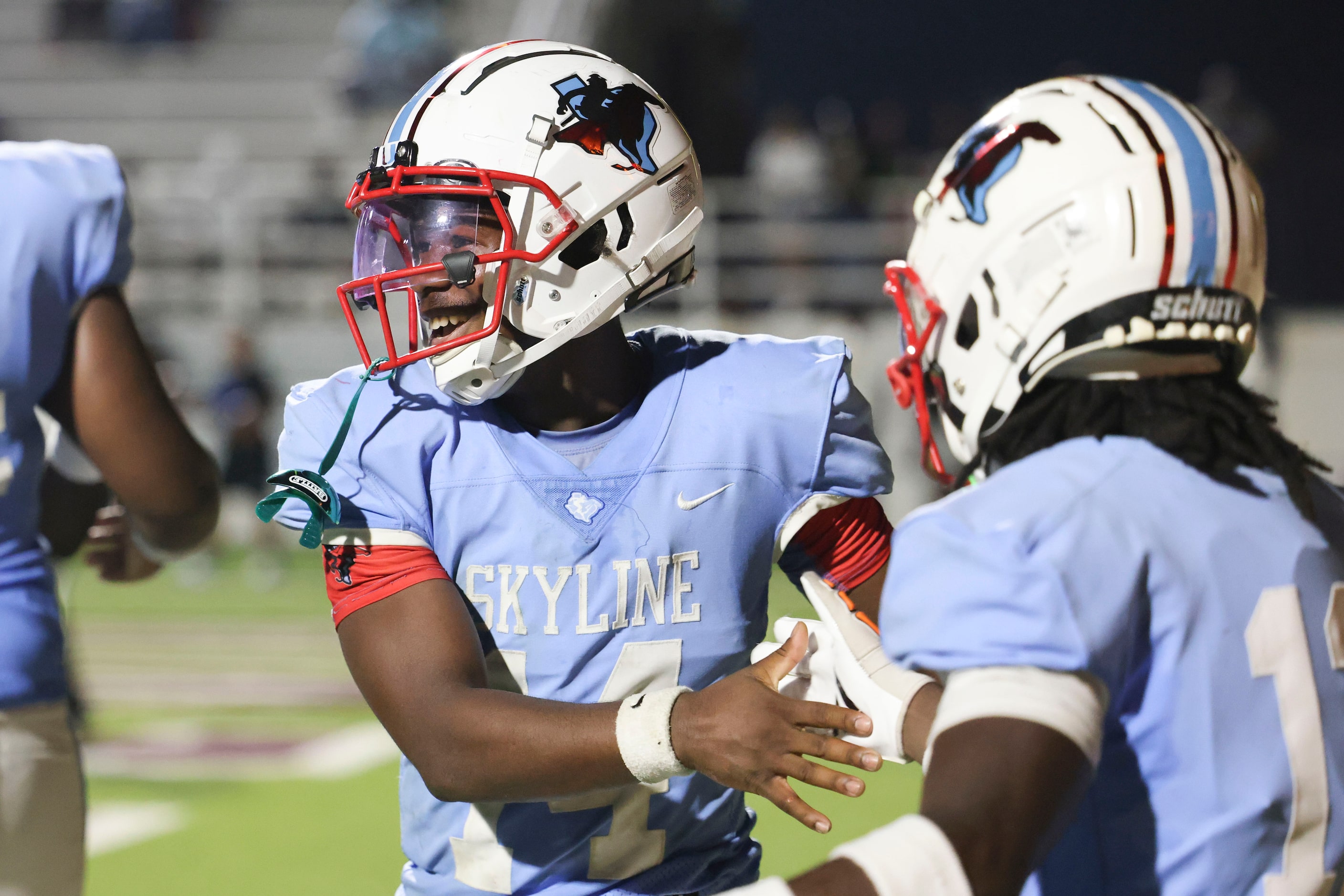 Skyline High’s QB Donte Ware celebrates after scoring a touchdown during the second half of...