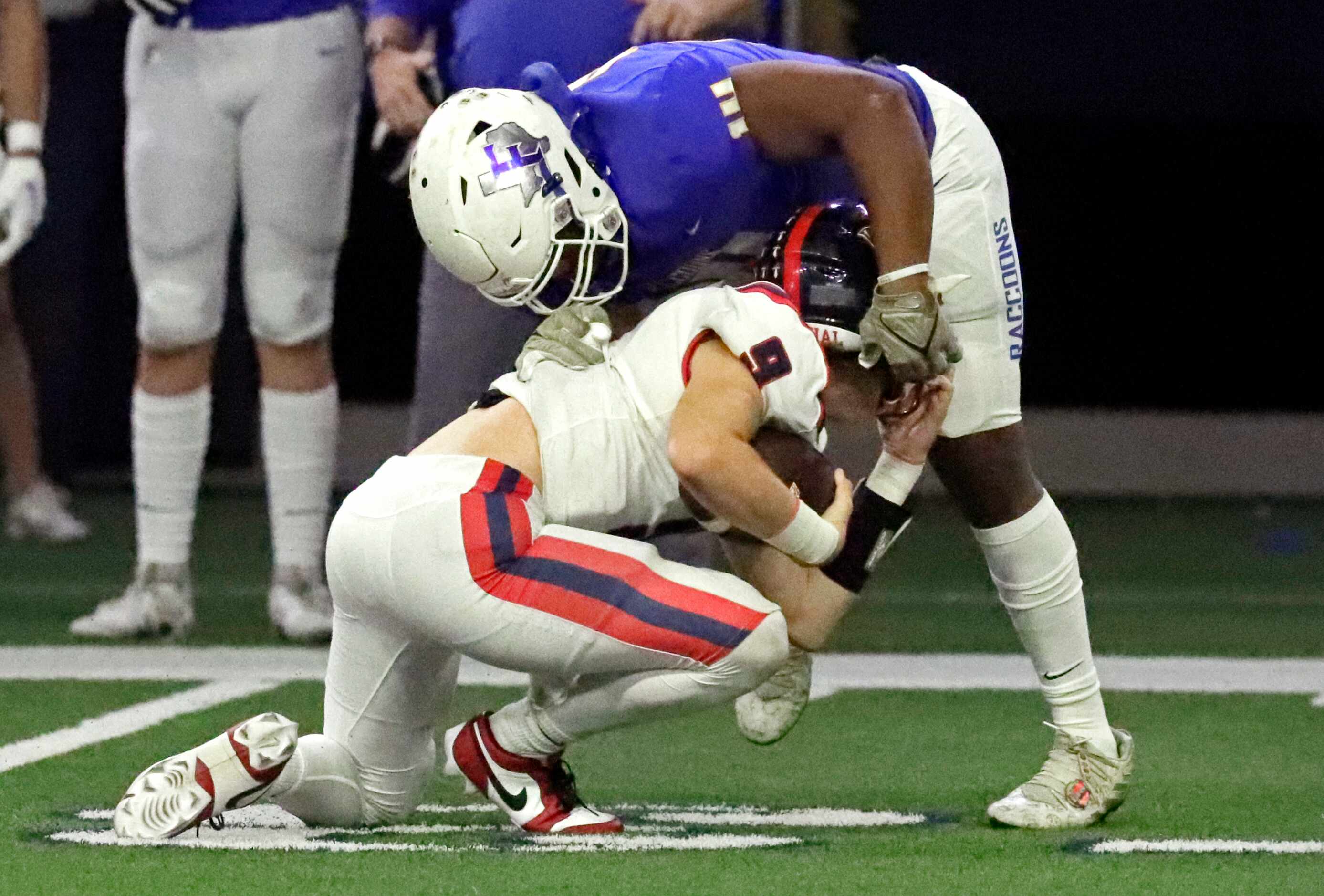 Frisco High School linebacker Reed Engleman (10) almost takes the helmet off of Centennial...