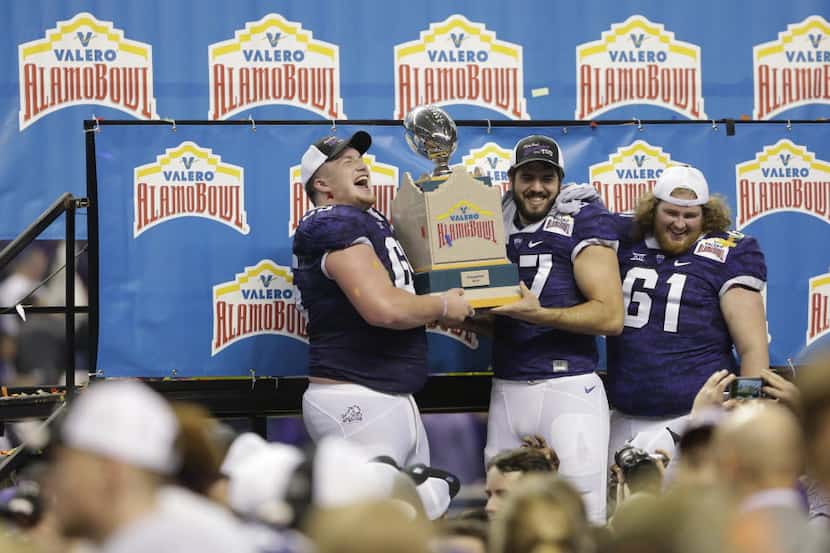 TCU  players celebrate after winning the Alamo Bowl NCAA college football game against...