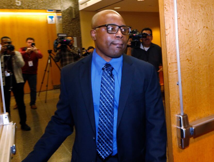 Former Farmers Branch police officer Ken Johnson enters the courtroom at Frank Crowley...