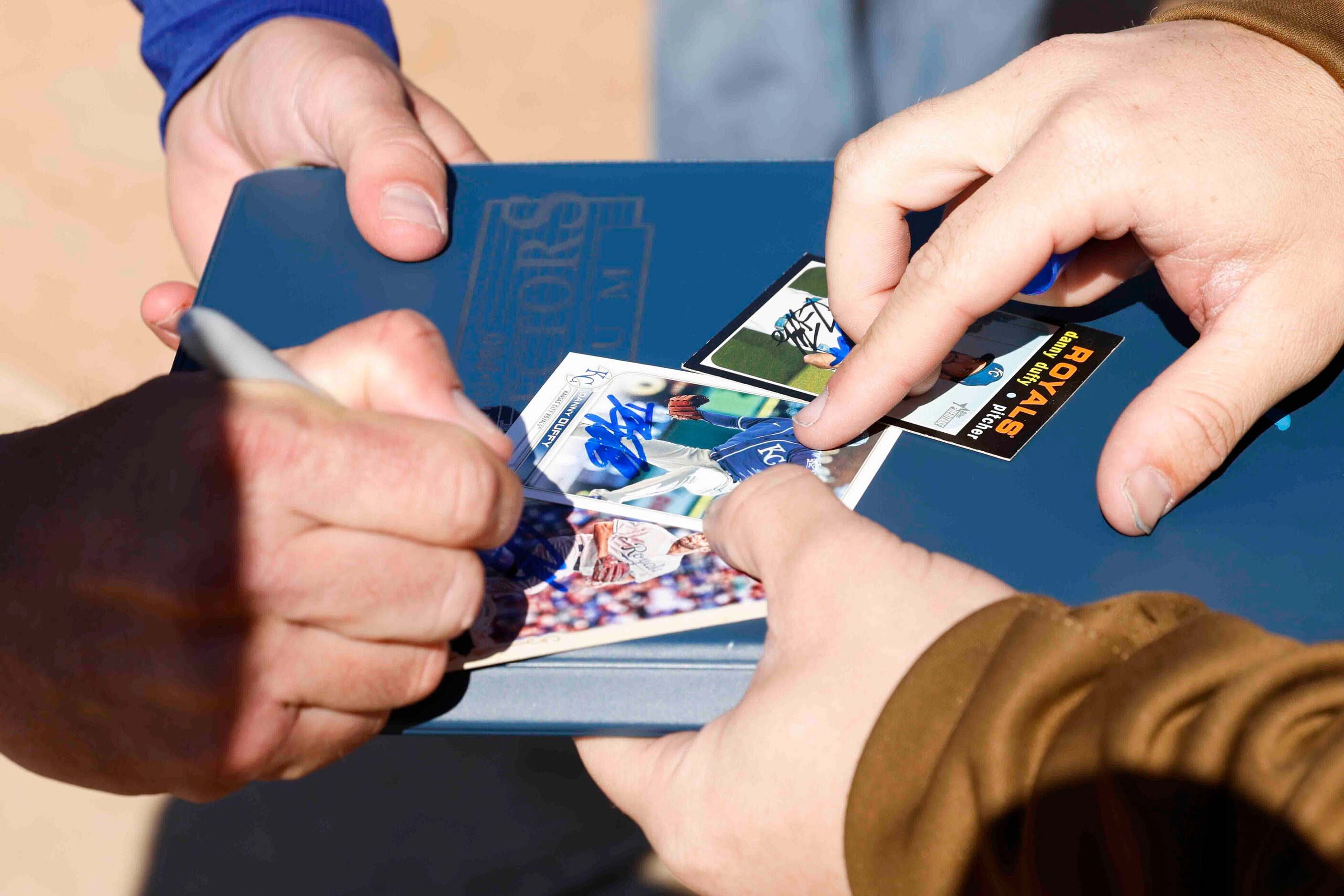 Texas Rangers left handed pitcher Danny Duffy gives autographs to fans before the first...