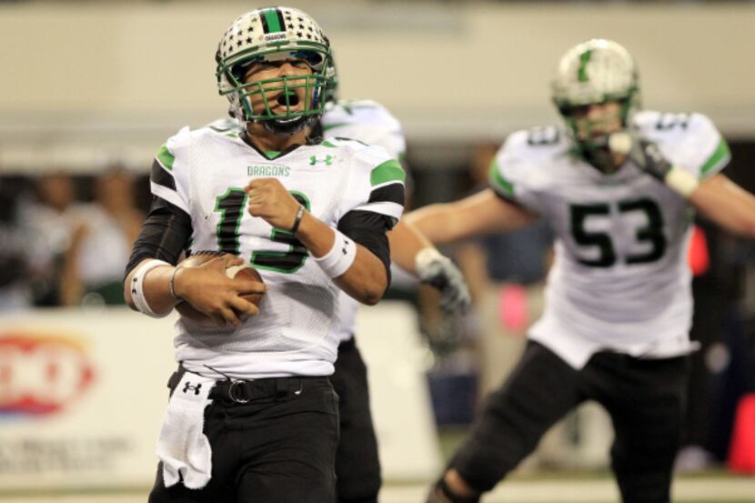 Southlake Carroll Dragons QB Kenny Hill (13) yells after scoring a TD during the UIL Class...