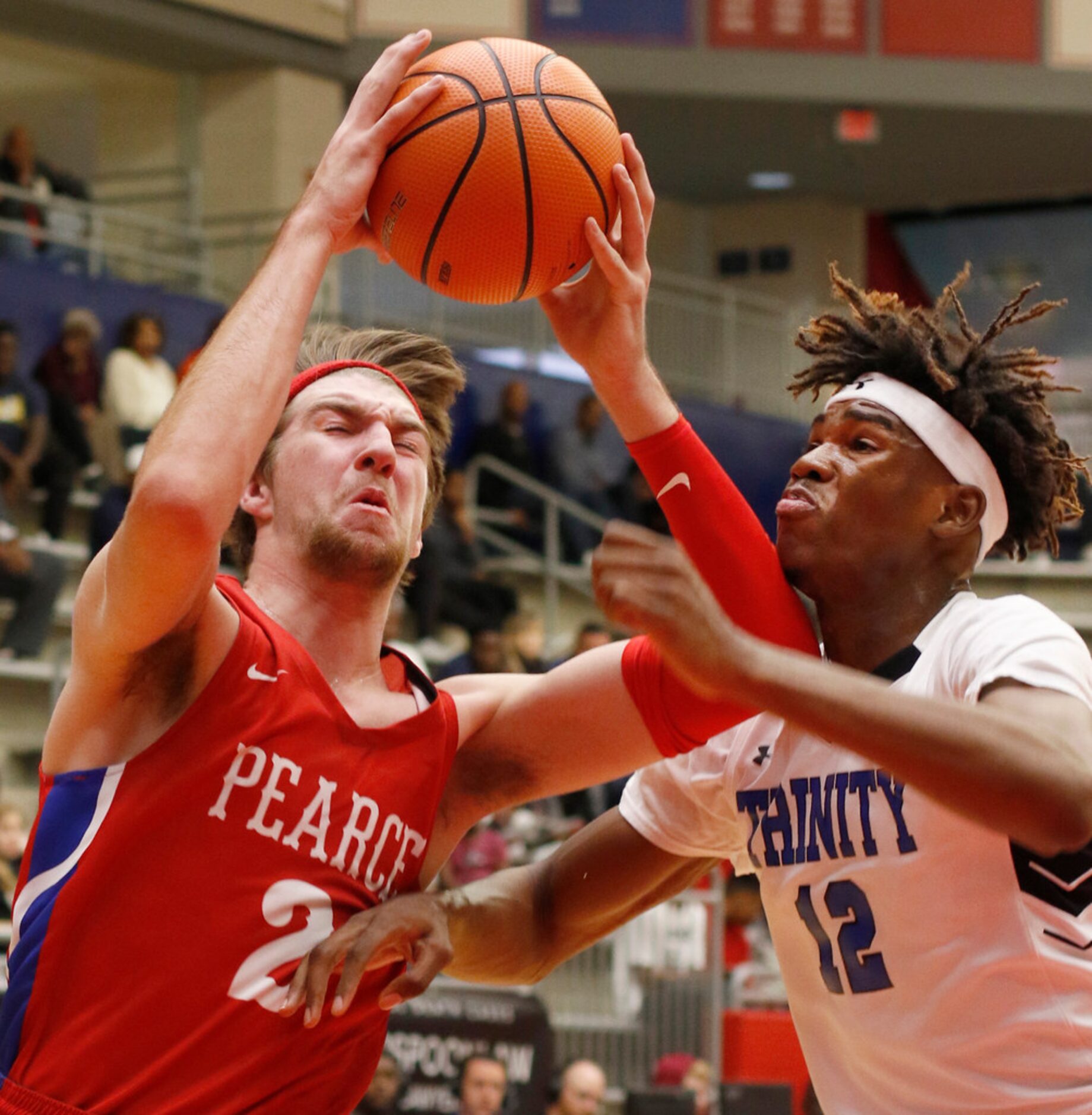 Richardson JJ Pearce post Drew Timme (2) winces as he drives hard to the basket as he is...