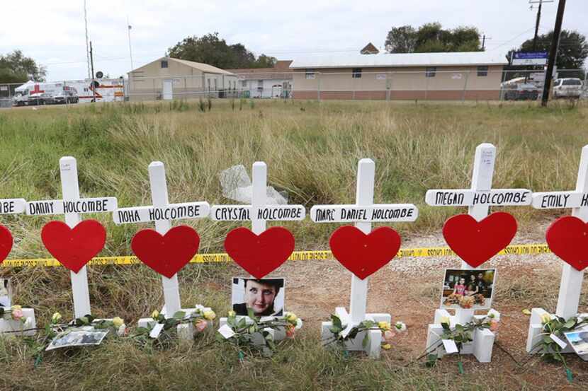 Wooden crosses honored the victims of the First Baptist Church of Sutherland Springs...