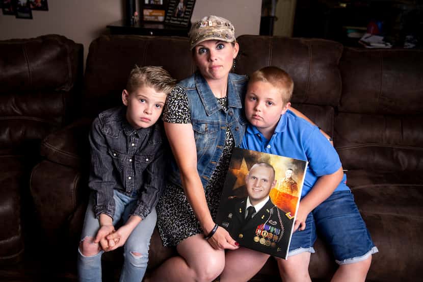 Aaden Welch, left, along with his mother Becky Welch and his brother, Robby Welch, 9, right,...
