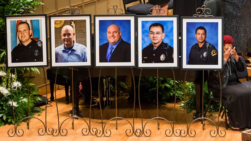 Photos of five officers who died were displayed during during an interfaith memorial service...