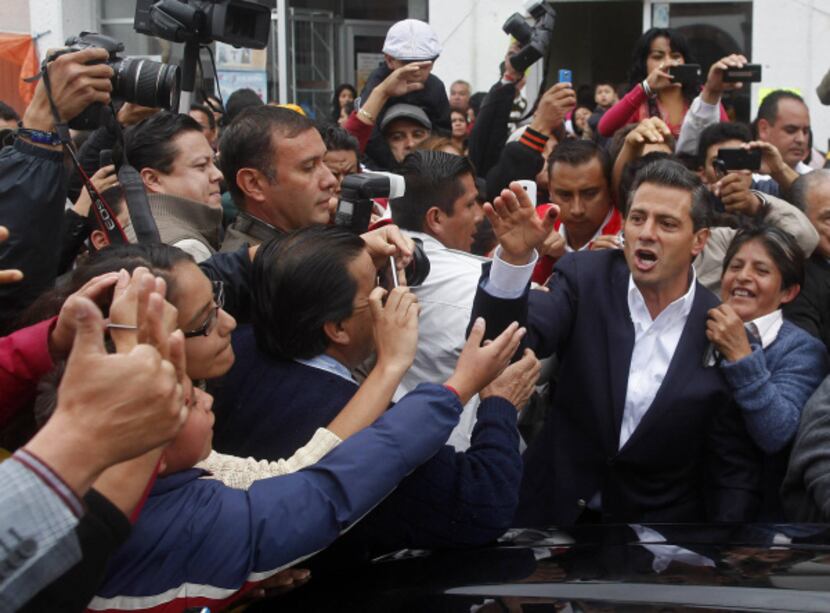 Enrique Peña Nieto (second from right) of the Institutional Revolutionary Party, or PRI,...
