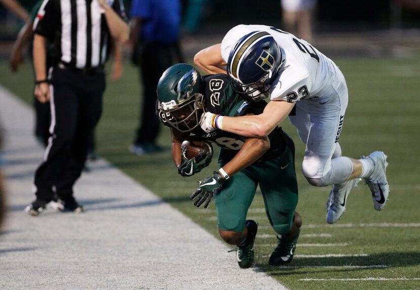 TXHSFB Jesuit junior linebacker Houston Hummel (23) tackles DeSoto senior running back...