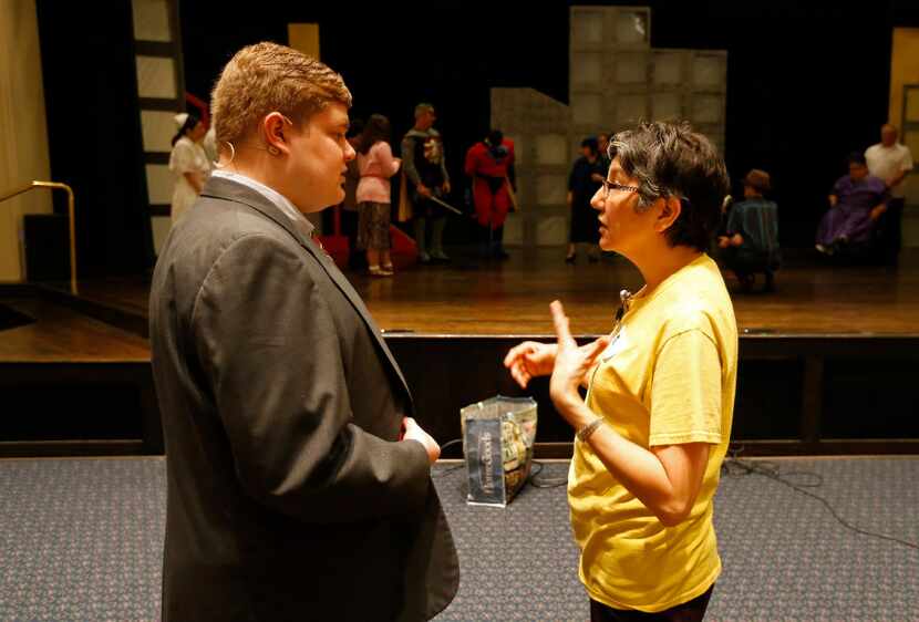 Director Lisa Schmidt talks with Michael Susens during a rehearsal at the church. 