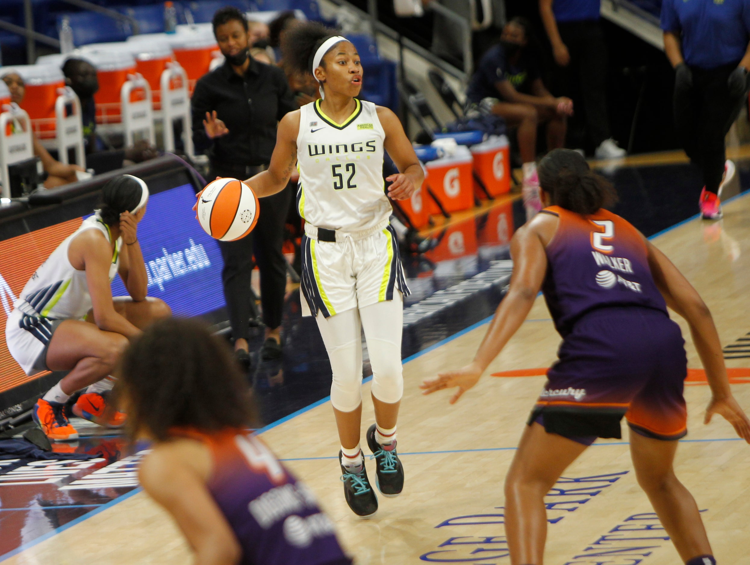 Dallas Wings guard Tyasha Harris (52) looks to pass as she sets up an offensive play during...