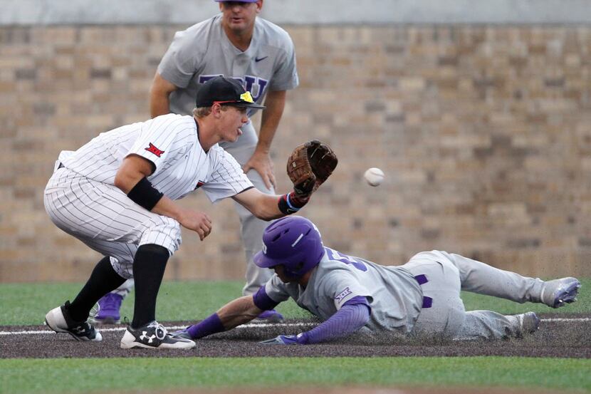 Texas Tech's Josh Jung catches the ball before making the tag on TCU's Nolan Brown during...
