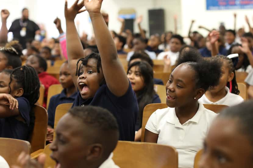 Children cheer during an event at the Charles Rice Learning Center in Dallas, TX, on Sep 29,...