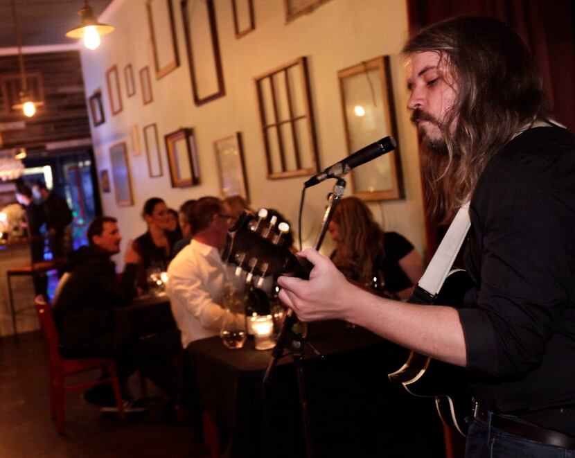 Andrew Rothlisberger performs during the Saturday-only "speakeasy" called XXVII Antique.