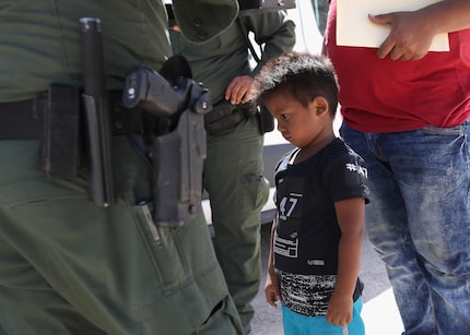 MISSION, TX - JUNE 12:  A boy and father from Honduras are taken into custody by U.S. Border...