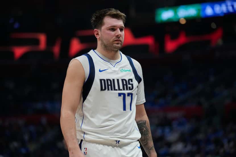 Dallas Mavericks guard Luka Doncic (77) reacts to a foul call during the first half of Game...