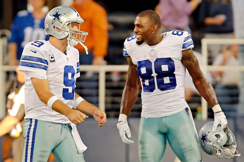 Dallas Cowboys quarterback Tony Romo (9) and wide receiver Dez Bryant are all smiles after a...