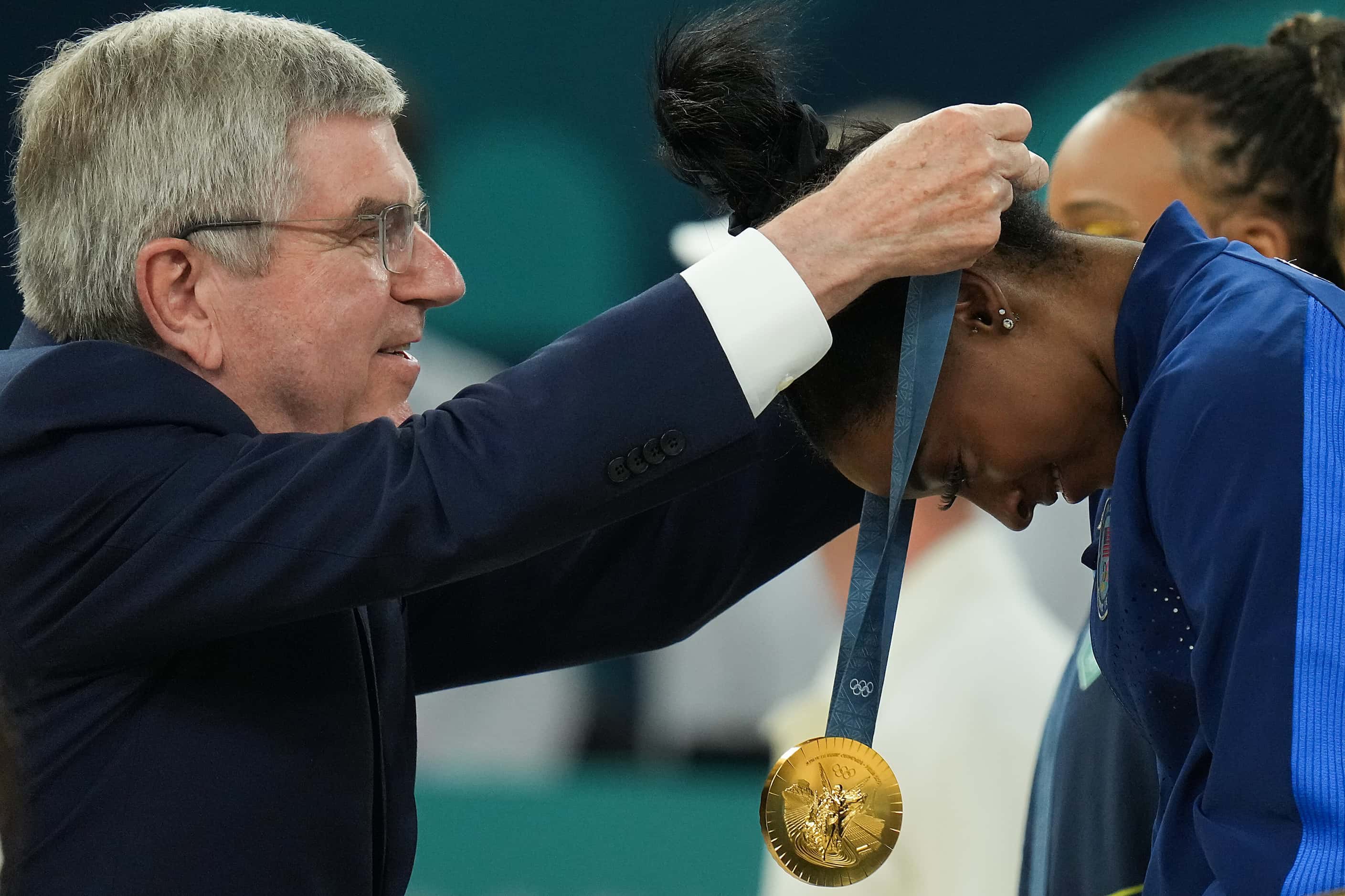 Simone Biles of the United States receives her gold medal for winning the women’s gymnastics...
