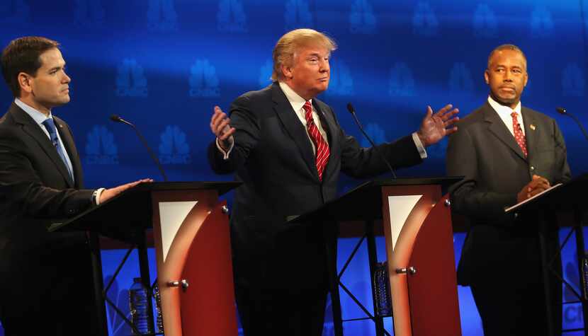 BOULDER, CO - OCTOBER 28:  Presidential candidates Donald Trump (L) speaks while Ben Carson...