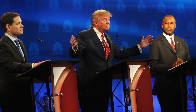 BOULDER, CO - OCTOBER 28:  Presidential candidates Donald Trump (L) speaks while Ben Carson...