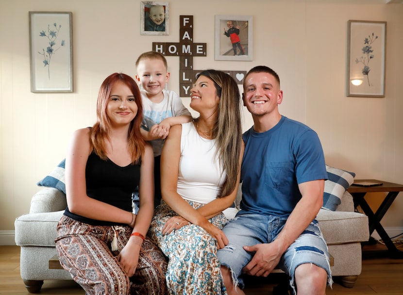 Stephanie Crawford (center), her daughter Kaydence, 14, and son Wesley, 4, and fiancé,...