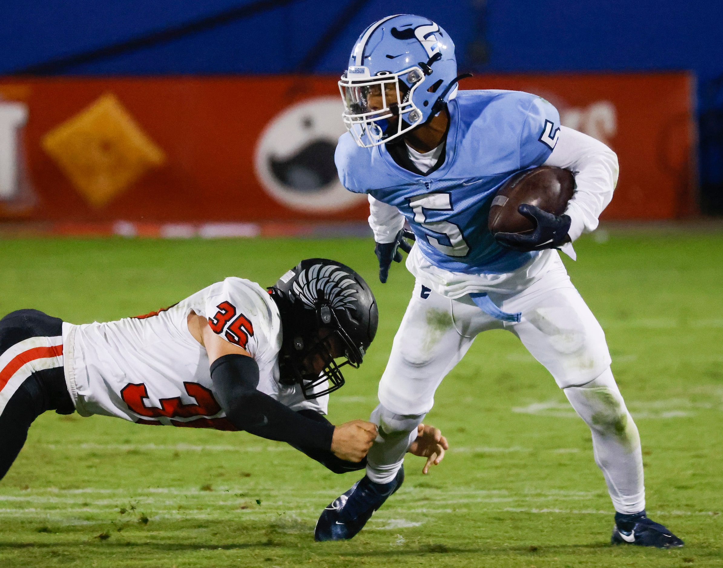 Emerson’s Bills Ishaqq (5), right, runs past Argyle’s Justice Jones (35) during the second...