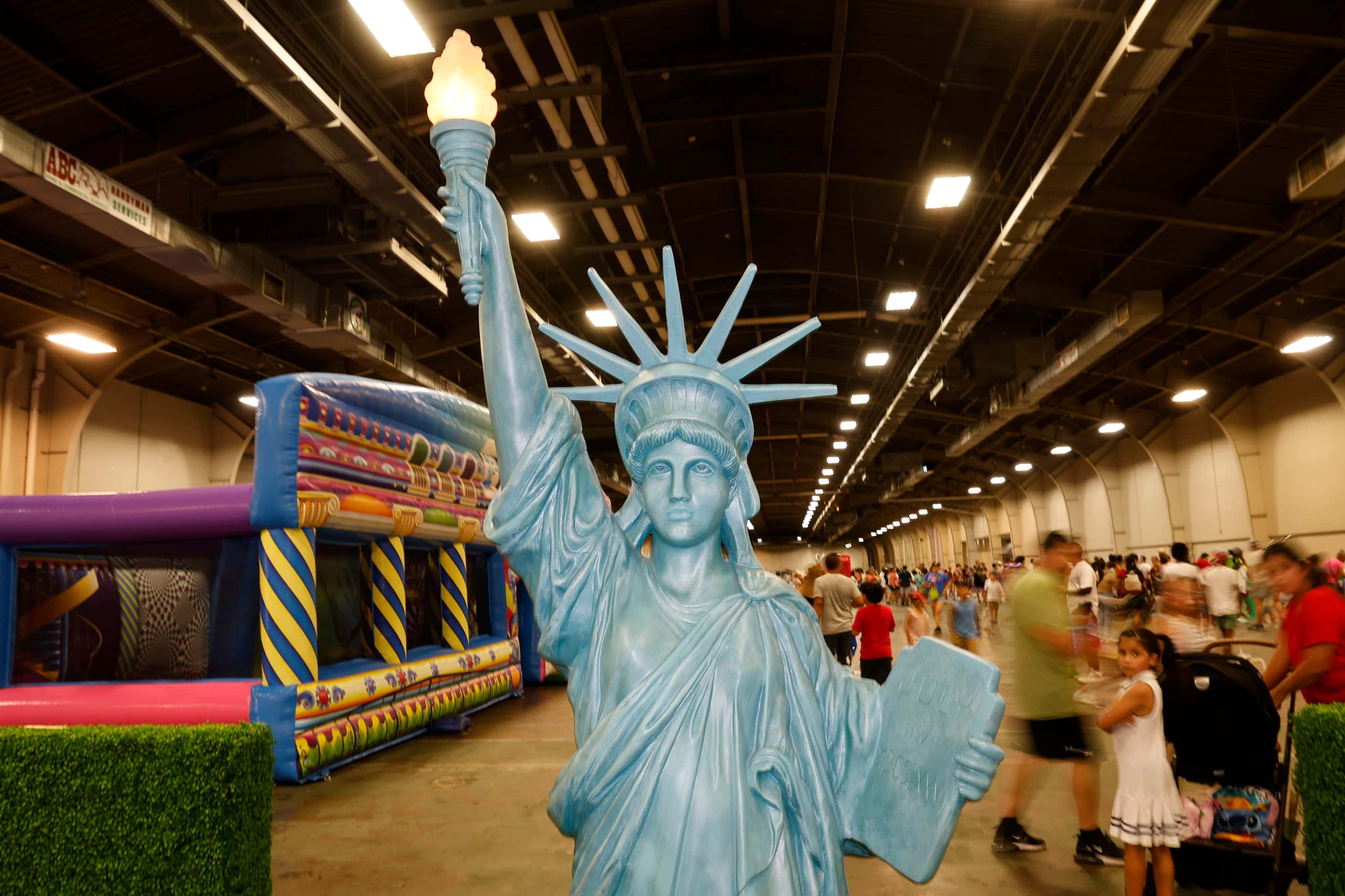 A replica of the statue of liberty is seen during the Fair Park Fourth celebration in Fair...