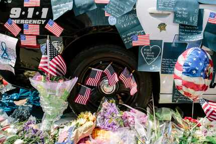 A makeshift memorial outside the Dallas Police Department headquarters for officers killed...