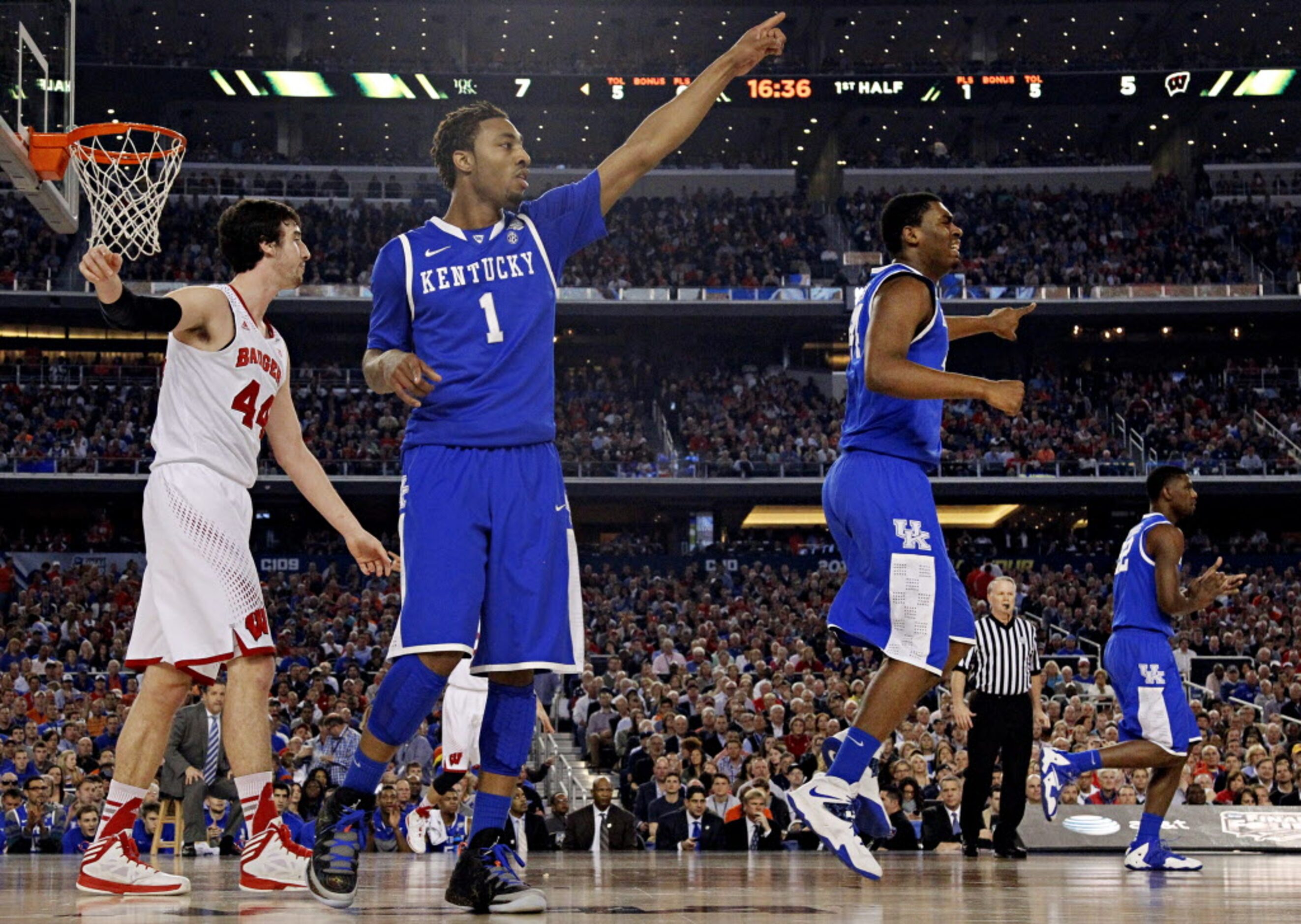 Kentucky Wildcats guard/forward James Young (1) and teammates react to a turnover during the...