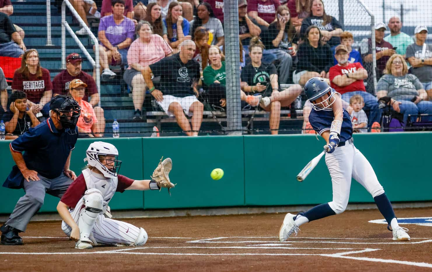 Frisco Lone Star second baseman Emma Zaboronek (7, right) swings for a pitch from Frisco...