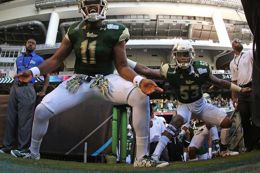 Marlon Pope #11 of the South Florida Bulls takes the field during the 2015 Miami Beach Bowl...