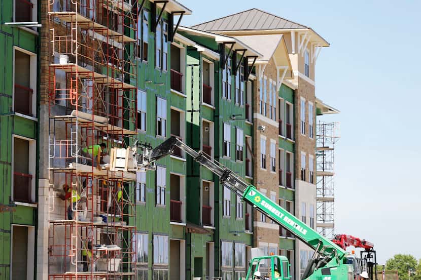 Construction work on an apartment complex in Frisco.