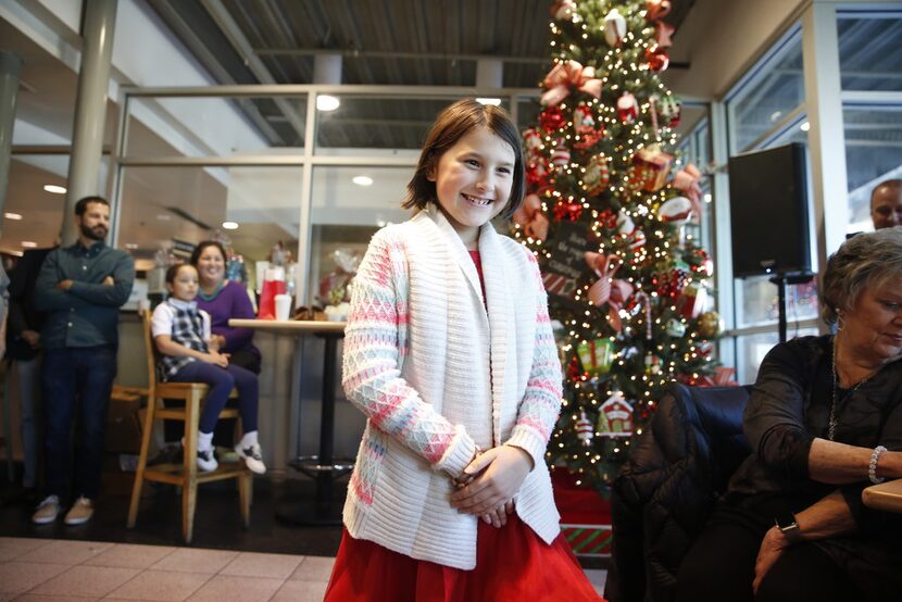 Ava Bell Reynolds smiles after winning in the Kid's category in The Dallas Morning News...