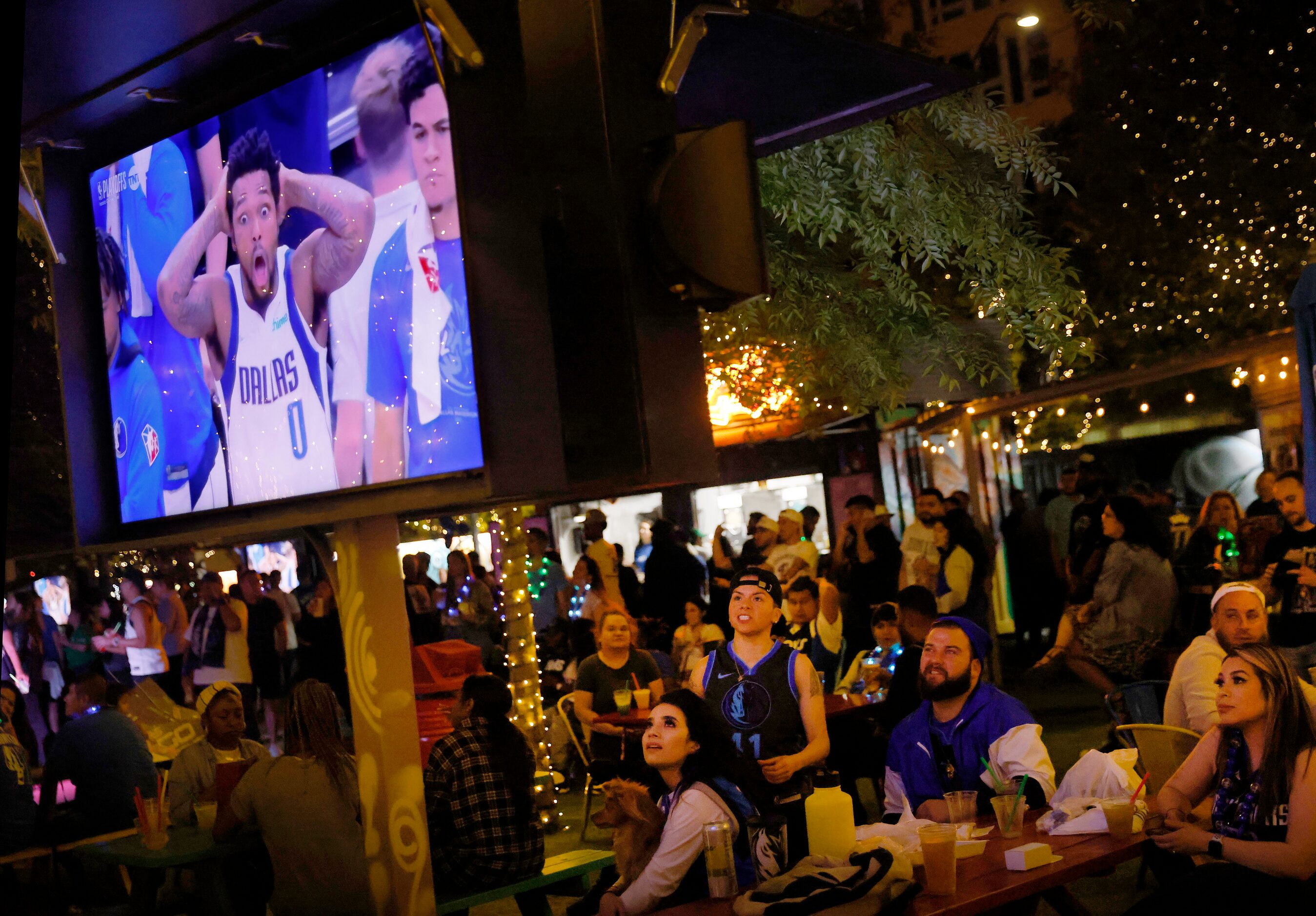 Dallas Mavericks forward Sterling Brown (on screen) reacts to a call as Mavs fans watch...