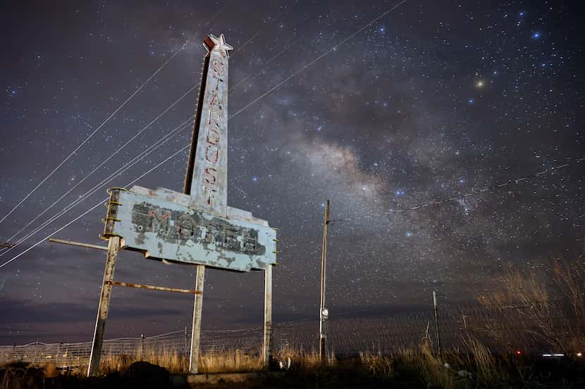 The Milky Way galaxy rises behind the old Stardust Motel sign outside Marfa, Texas, March...