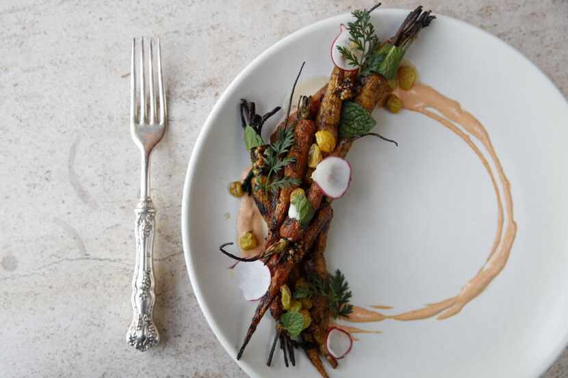 Wood-roasted baby carrots is one of the modern Southern dishes on the menu at Filament. Cody...