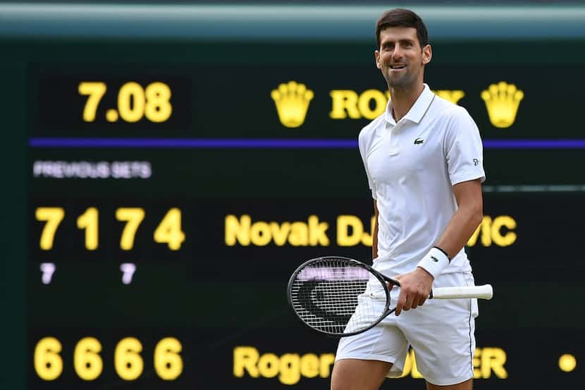 Serbia's Novak Djokovic celebrates beating Switzerland's Roger Federer during their men's...