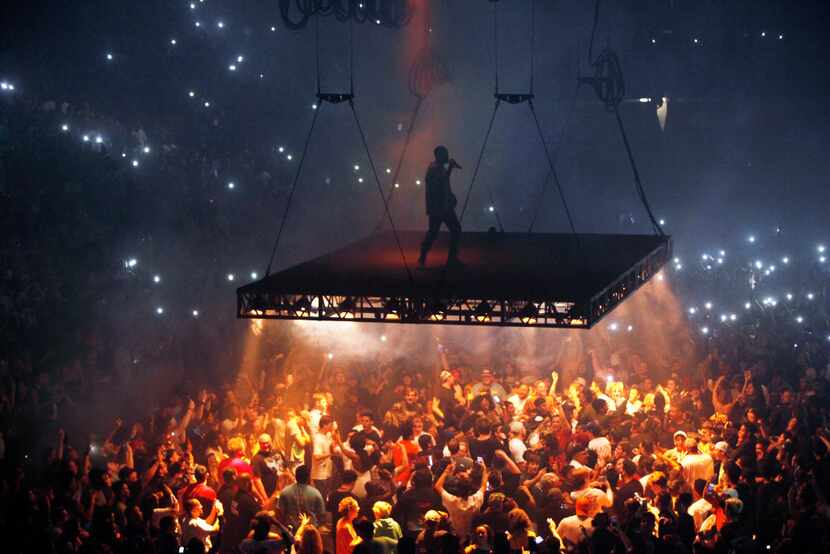 Kanye West sang on a stage that hovered over the crowd during his performance Thursday at...