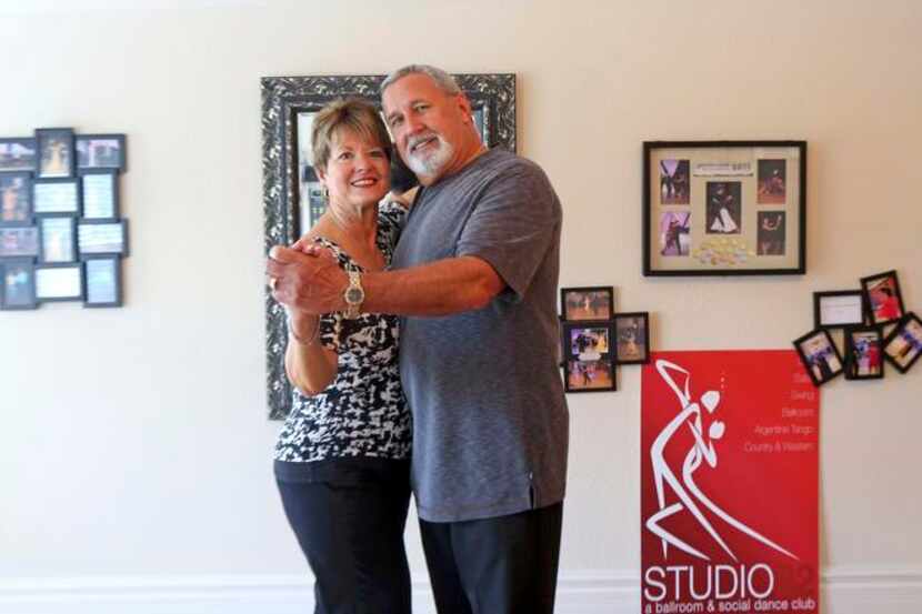 
Christine and Marvin Garrett strike a pose on the dance floor in their Allen home. “We do...