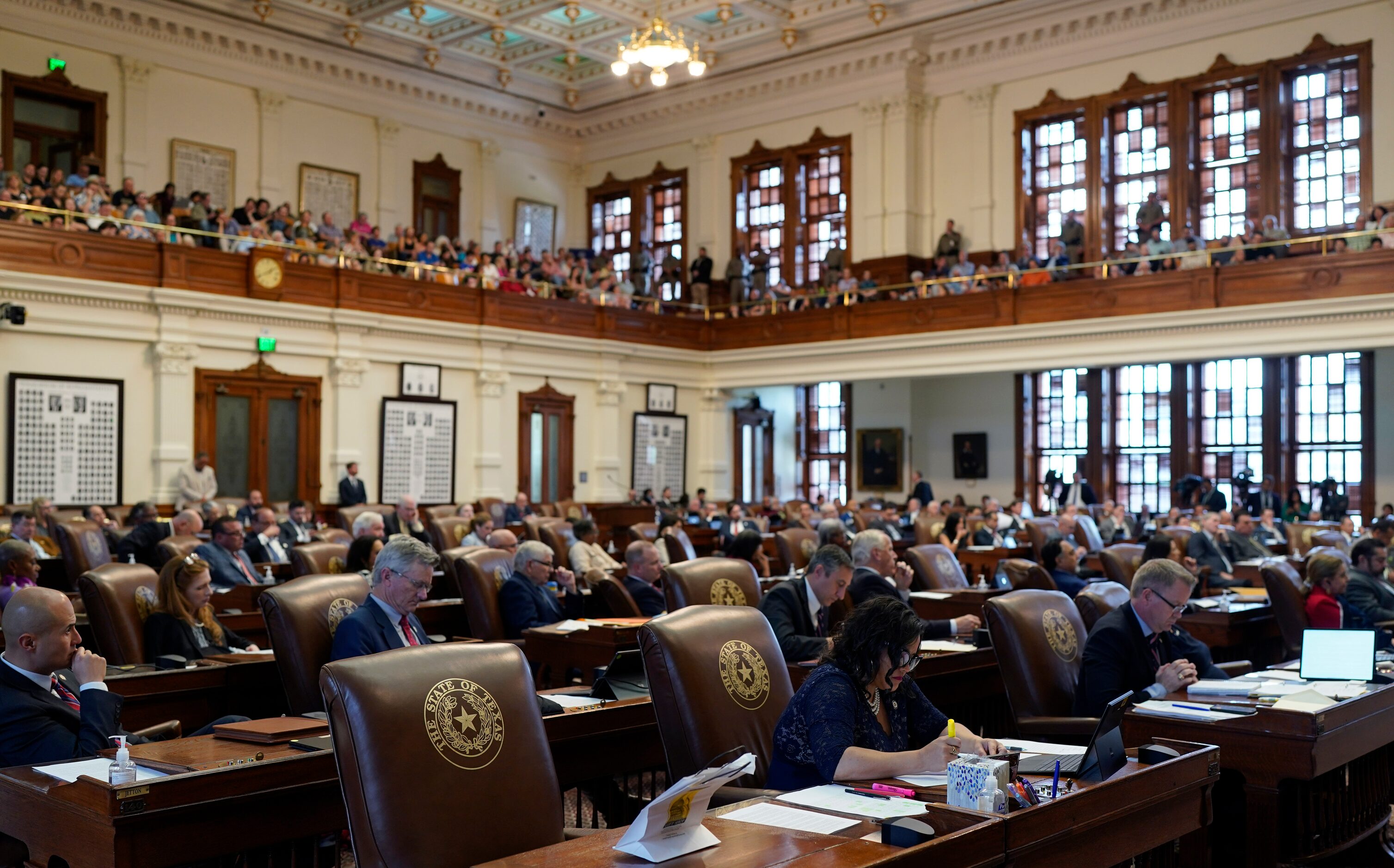 House members and visitors listen to the impeachment proceedings against state Attorney...