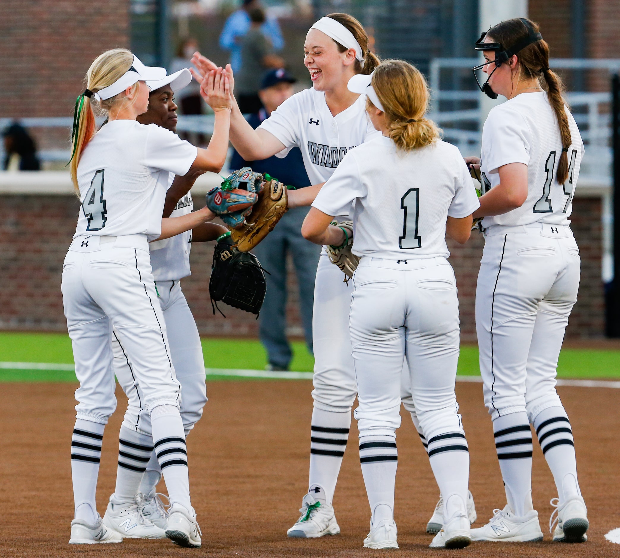 Denton Guyer's Kate Moala (17) celebrates with teammates during the third inning of a...