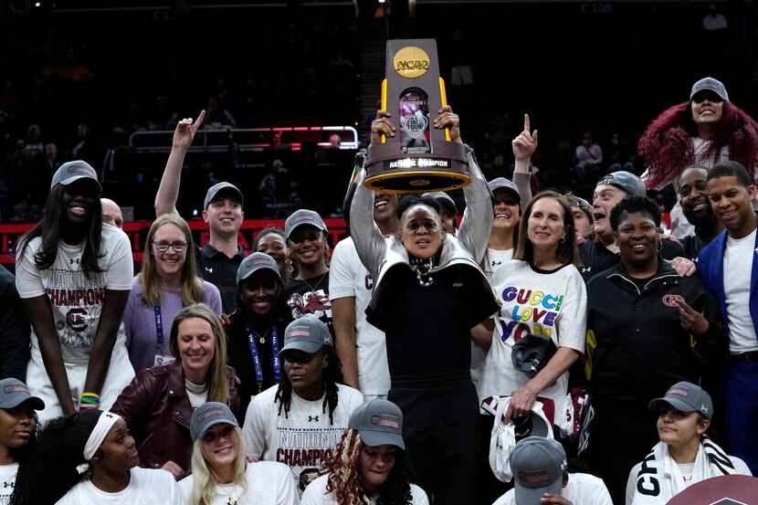 South Carolina head coach Dawn Staley celebrates with her team after the Final Four college...