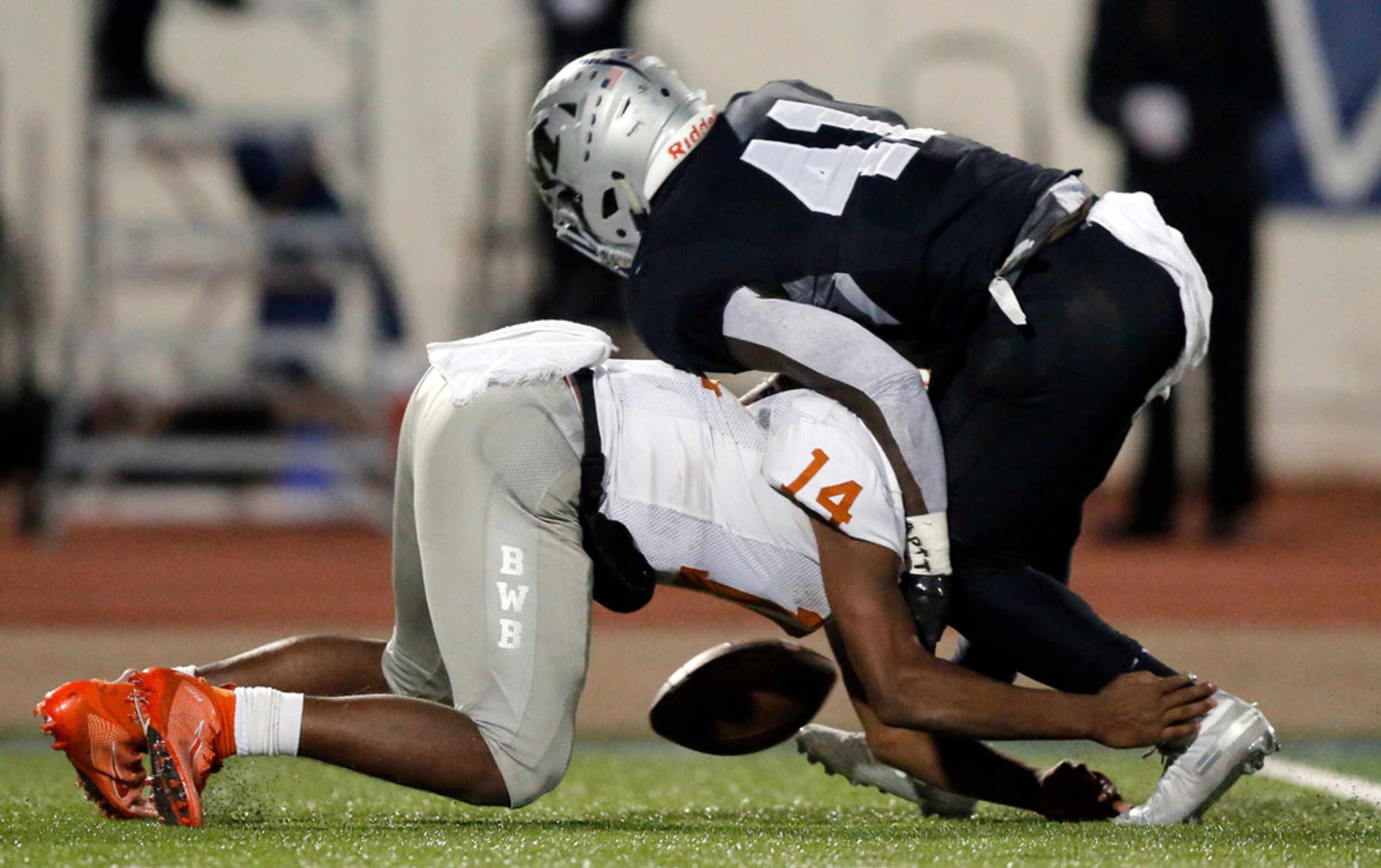 Martin High's Chris Craft (41) tackles Bowie punter Drevvon Ponder after a high snap during...