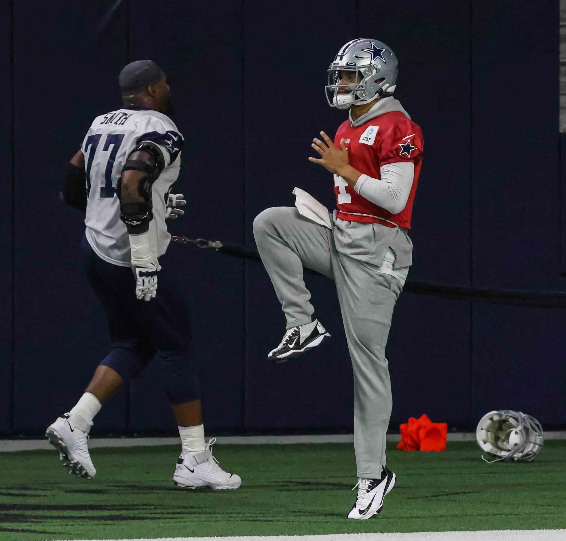 Cowboys' quarterback Dak Prescott #4 and offensive line Tyron Smith #77 during practice at...