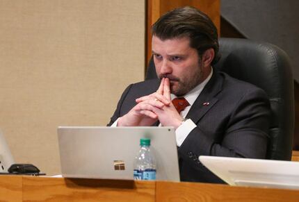 District 2 Commissioner J.J. Koch listened during a meeting of The Dallas County...
