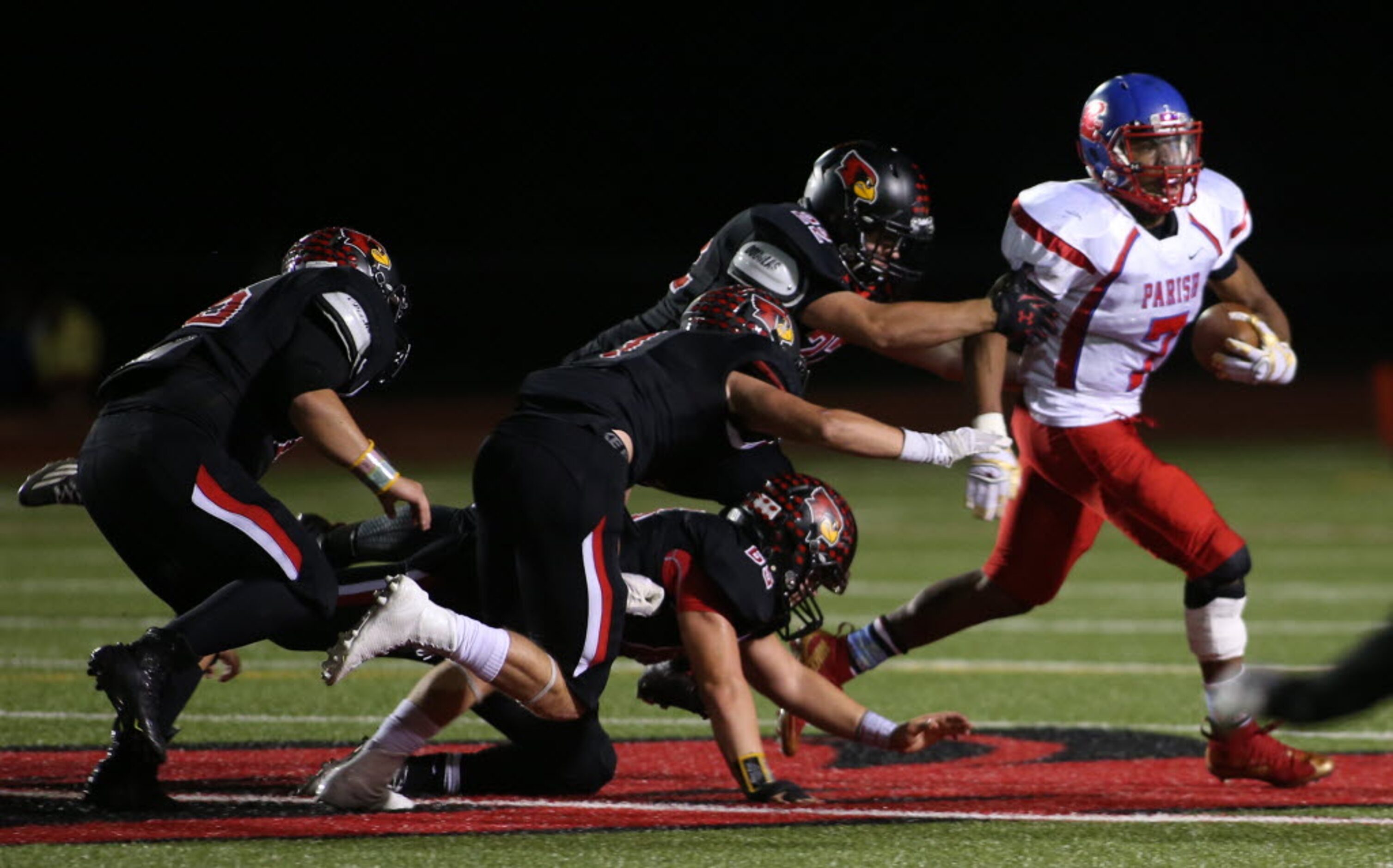 Parish Episcopal’s Dominic Williams (7) is pressured by Fort Worth Christian’s defense...