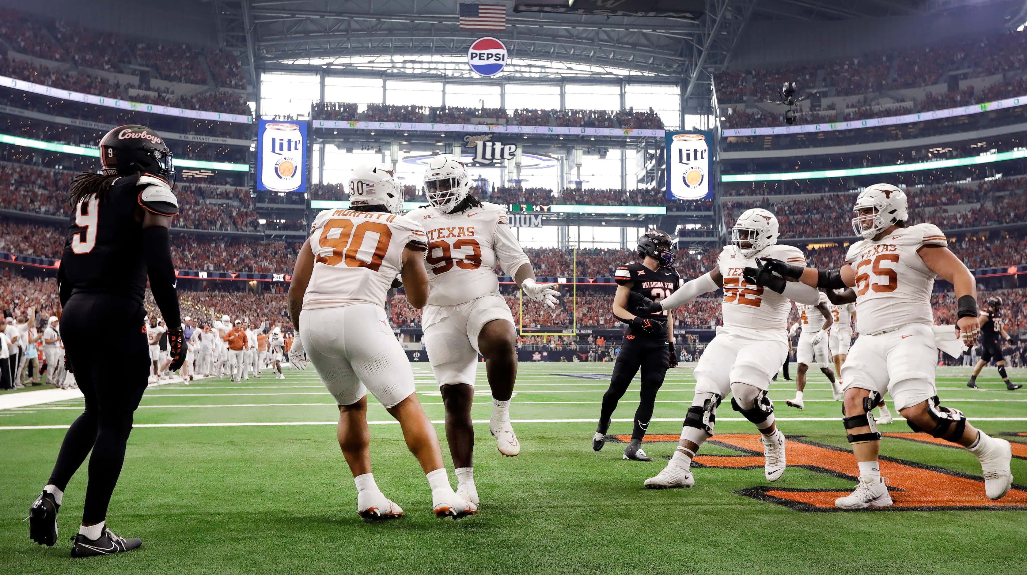 Texas Longhorns defensive lineman T'Vondre Sweat (93) is congratulated in the end zone by...
