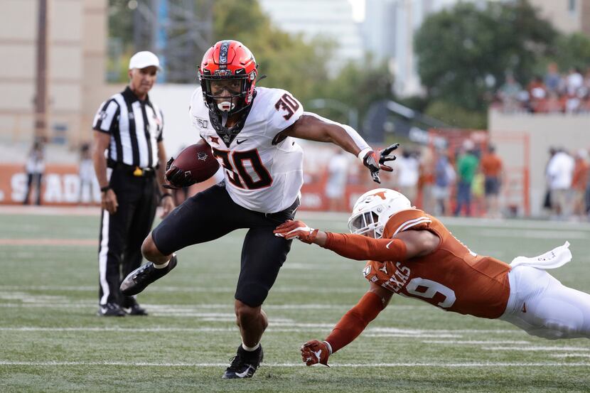 Oklahoma State running back Chuba Hubbard (30) runs against Texas during the first half of...